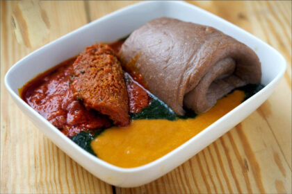 Amala, Gbegiri and Ewedu in a white plate