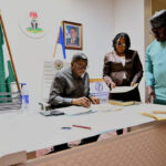 Gov Otu signs bills