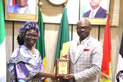 Olubunmi Tunji-Ojo receiving an award,