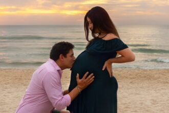 a pregnant woman wearing a stylish outfit