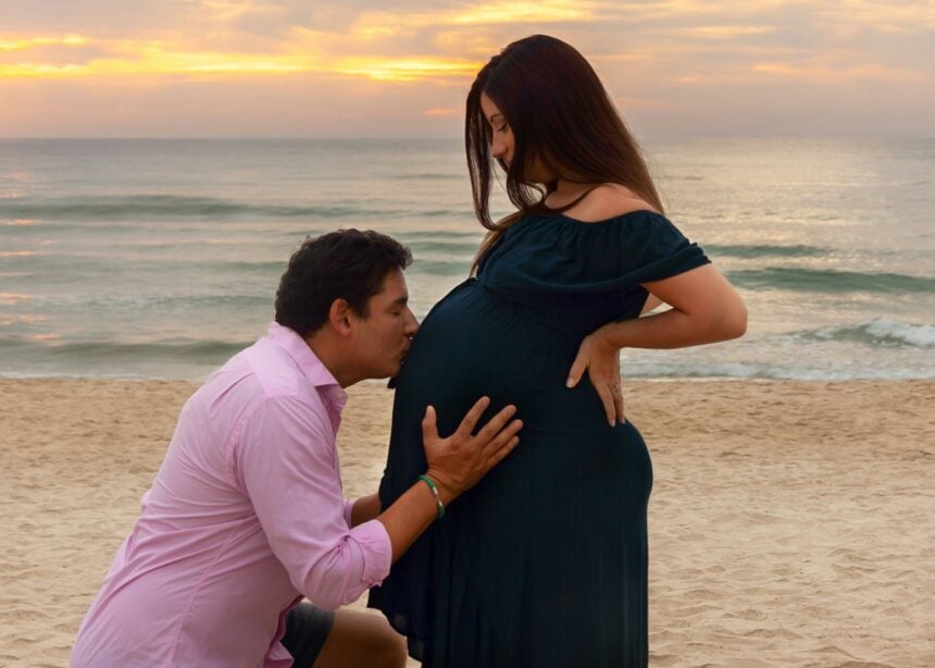 a pregnant woman wearing a stylish outfit