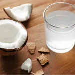 coconut and its water in a cup
