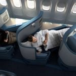 Delta airbus flight with passengers on flat-bed seats,