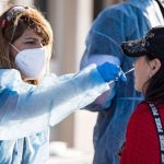 An health worker conduct test for new covid variant,