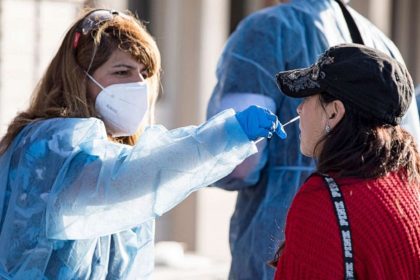 An health worker conduct test for new covid variant,
