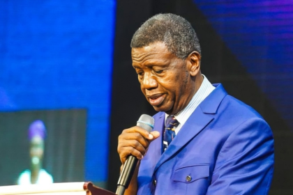 Pastor Adeboye with a microphone