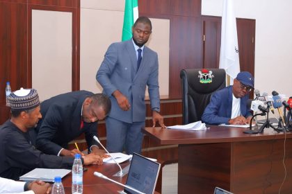 Nyesom Wike signing agreement for Abuja City Walk project,