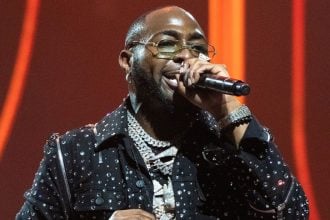 Davido performing on stage,