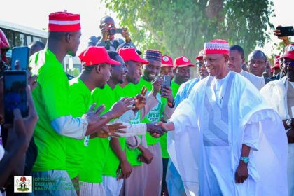 Kano governor, Abba Kabir Yusuf shaking the beneficiaries