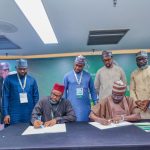 Zamfara State governor, Dauda Lawal and REA Managing Director, Abba Abubakar Aliyu signing the MoU on solar energy,