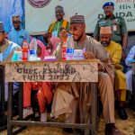 Governor Dauda Lawal eating in a school in Zamfara,