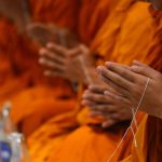 Thai monks praying,