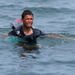 A Moroccan boy swimming to the Spanish enclave of Ceuta