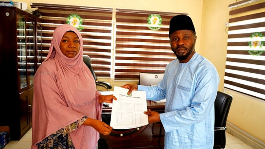 Outgoing acting coordinator Fatima Bakari handing over to NEDC new coordinator, Barrister Lawal in Adamawa
