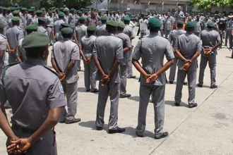 Customs officers on parade ground, Apapa Customs generates N1.38trn, seals three bonded terminals in six months