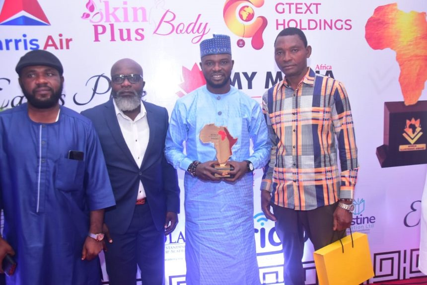 Prince Kolade Afeez Siyanbola Oladigbolu with award plaque