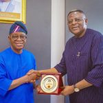 Cross River State Governor, Bassey Edet Otu presenting award to Minister of Marine and Blue Economy, Gboyega Oyetola during visit to Cross River over Bakassi Deep Seaport.