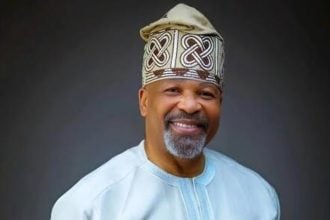 Yemi Solade smiling,