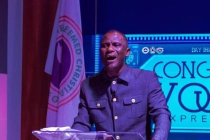 Pastor Sola Owoeye praying