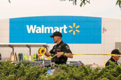 Scene of stabbing incident at Michigan Walmart being demarcated by a Police officer