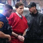 Kohberger handled by police men