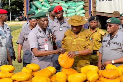 Comptroller, Federal Operations Unit, Zone A, Mohammed Shuaibu hands over seized Cannabis Sativa to NDLEA officials while representative of the Customs CG and Coordinator, Operation Whirlwind, ACG Hussein Ejibunu watches at the weekend