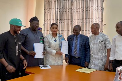 The Special Adviser on SDGs to Governor Monday Okpebholo (3rd left), Ms Sally Suleiman, presenting the Memorandum to the Acting Vice Chancellor of Ambrose Alli University, Prof. Sunday Olowo Samuel, while the Head of Partnerships at OPay, Ikponmwosa (IK) Kolawole Odiase (2nd left), looks on in support.