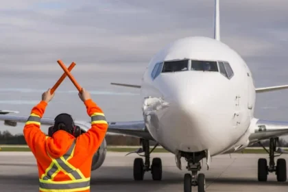 Aviation worker in front of an airplane