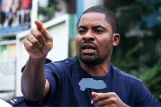 Deji Adeyanju with a pointed finger