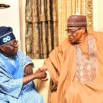 President Bola Tinubu shakes IBB
