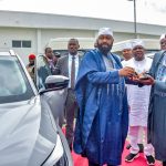 Governor Bago presenting official key to beneficiary in Niger