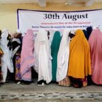 Internally Displaced Persons (IDPs) facing the wall