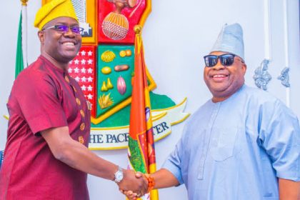 Makinde and Adeleke exchanging handshake