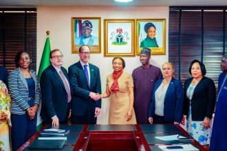The Federal Ministry of Industry, Trade and Investment OFFICIALS in a meeting the outgoing United States Ambassador, Richard M. Mills Jr., and the incoming US Consul General to Nigeria, Rick Swart.