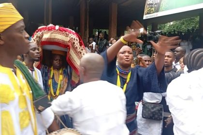 A male priest carring sacred calabash at the 2025 Osun-Osogbo festival