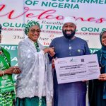 First Lady, Remi Tinubu, presenting N1 billion donation cheque to Governor of Niger State, Umar Bago over Niger flood