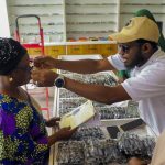 One of the beneficiaries of the eye care outreach from Saudi Arabia receiving glasses from one of the doctors.