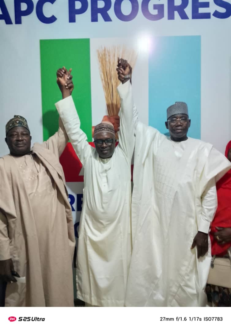 APc party members raising Former PDP's financial secretary, Hon. Nasiru Yahaya Isa's hands
