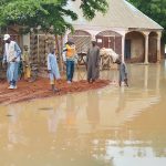 Officials and residents at the scene of the flood ravaging Sokoto communities