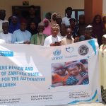 UNICEF stakeholers on Alternative Care for Children holding a banner on Institutionalisation of children