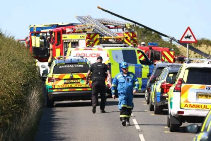 Images from the crash site show a number of ambulances, fire engines and police cars parked up along Shanklin Road, the rotors of the crashed helicopter appear to be poking out from the field, another angle shows a yellow Hampshire and Isle of Wight Air Ambulance stationed in the field as emergency crews work continue to work at the scene.
