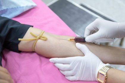 blood being drawn with a syringe from someone's arm for a blood test