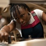 carpenter-cutting-mdf-board-inside-workshop