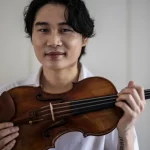 Berlin-based South Korean violinist Inmo Yang poses with the "Carrodus violin" in Berlin, Germany