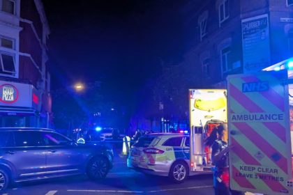 Police and paramedics at the scene of the shooting in Stoke Newington