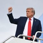 President Donald trump raising up his fist