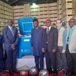 Executive Director of NPHCDA, Dr. Muyi Aina recieves solar-powered refrigerators,