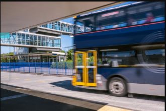 A bus at a park and ride transport station busway on North Shore, New Zealand.