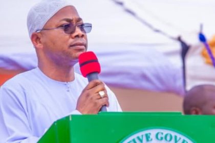 Kogi Governor, Alhaji Ahmed Usman Ododo holding a microphone