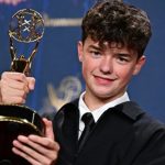 Owen Cooper receiving Emmy's award